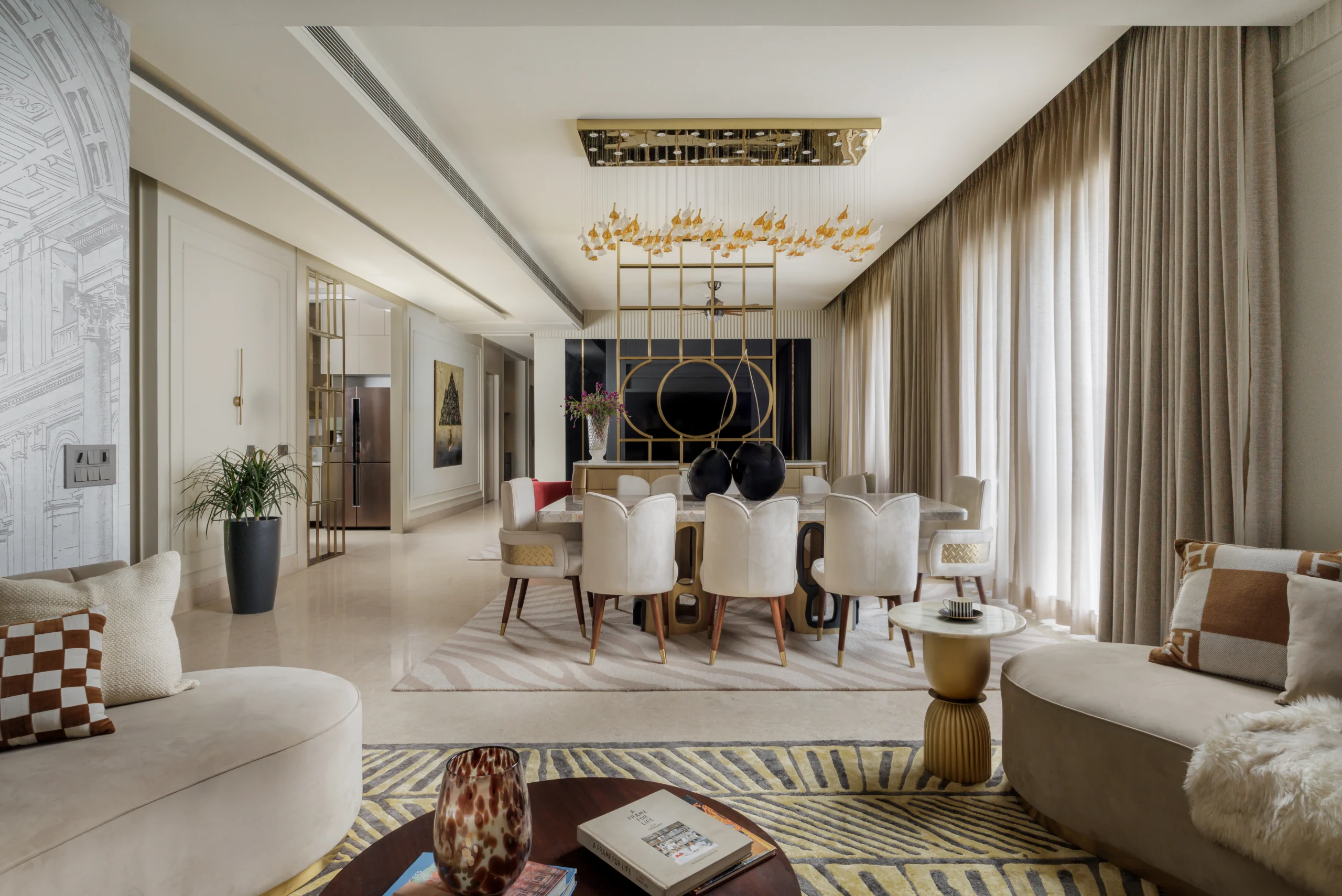Dining area with marble table and warm tailored seating